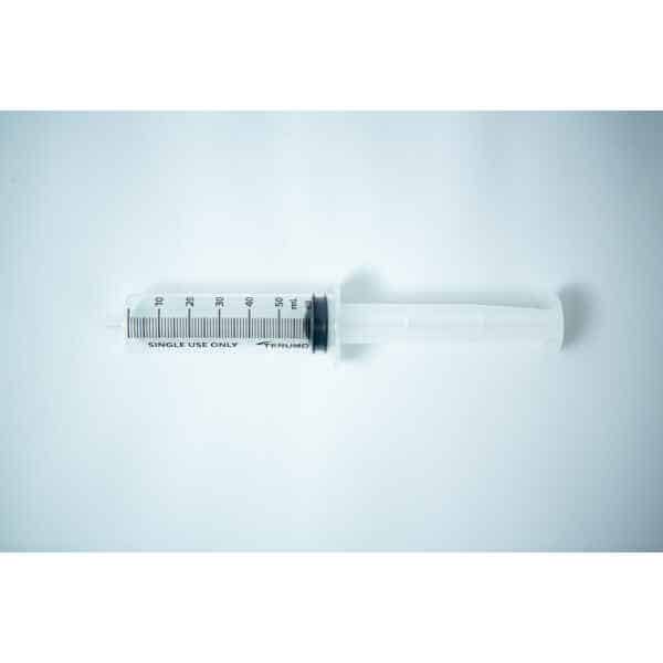 A large, empty plastic Syringes Luer lock with Hypodermic Needle and syringe Cap set labelled "single use only" on a white background—ideal for those seeking to buy syringes or browse syringes for sale online.