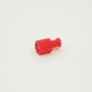 Small red sterile syringe cap with a ridged grip, placed on a plain white background.