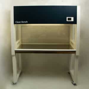 A laboratory clean bench with a glass work surface and overhead lighting, on four castors.