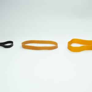 Ten reusable Fruiting Rubber Bands for mushroom growing are arranged on a white background—perfect for cultivation.