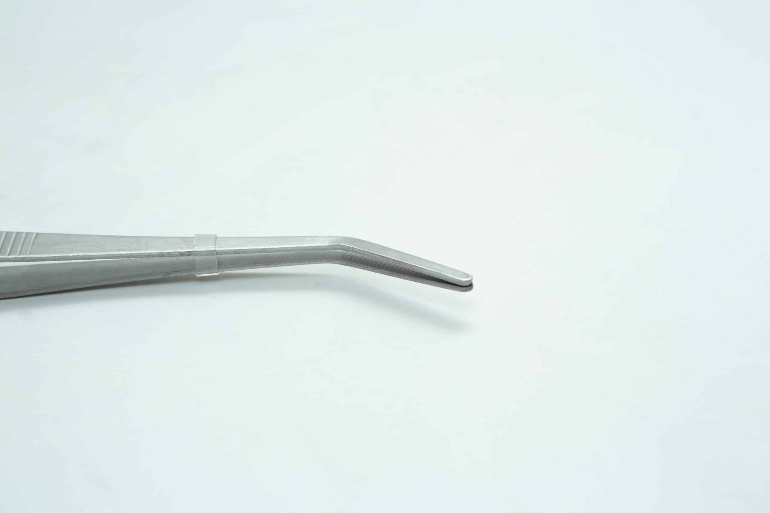 Stainless Steel Plant tissue culture Lab Forceps | Curved & Straight Tips | 25cm 3 A close-up of a metal tweezer with a curved tip against a plain white background.