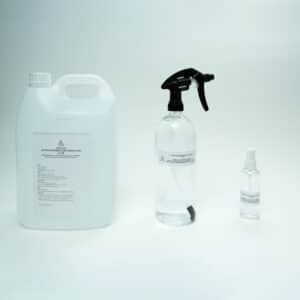 Three clear bottles of varying sizes with white labels, containing Hypochlorous Acid (HOCL) | PPM 40 for cleaning, displayed on a plain white background.