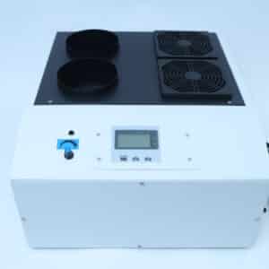 White electronic device with two vents, control panel, two fan grilles, and a visible power lead on the right.