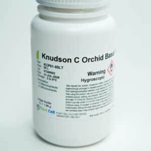 A white plastic bottle labelled Knudson C Orchid Base with warning text and storage instructions.