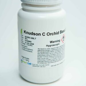 A white plastic bottle labelled Knudson C Orchid Base with warning text and storage instructions.
