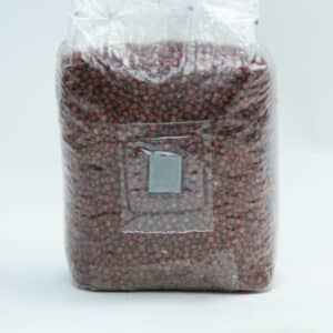 A sealed plastic bag filled with small brown seeds or grains on a plain white background.